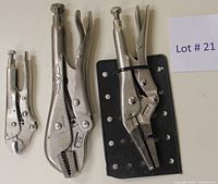 Fully visible set of three locking pliers of different sizes with rubber backing and a lot number card.
