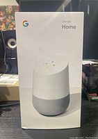 Front of the sealed box showing the Google Home speaker image and branding