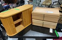 Photo of three wood display boxes: two matching Meeden drawer boxes stacked and one larger box with sliding wood slat doors