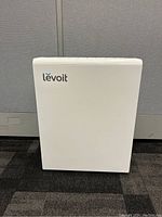 Front view of white Levoit air purifier showing branding and overall condition