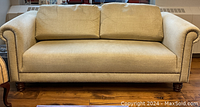Front view of sofa showing overall appearance and cushioned seating