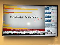 Front view of powered-on Samsung TV displaying BNN Bloomberg broadcast