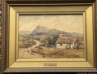Full view of framed watercolour painting showing cottage and landscape, with title plaque.