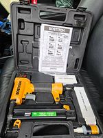 Overall view of finish nailer kit in black hard plastic case