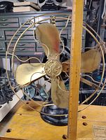 Front view with ruler showing approximate cage diameter and brass blades