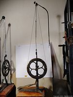 Full front view of cast iron foot-powered dental drill stand