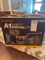 Photo of original Canon A1 video camera box showing branding, model details, and digital kit features.