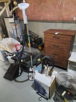 Photo of the Tobi Perfect Steam Pro steam cleaner standing upright with hose and wand attachment, showing the dryer and wall behind.