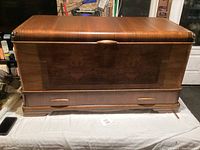 Front view of closed chest showing veneer finish and drawer