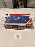 Box top showing X-Wing fighter artwork and 1:48 scale designation.