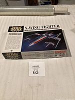Boxed FineMolds Star Wars X-Wing Fighter model kit, front view showing detailed box art and branding.