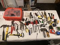 Overview of tools laid out on a white surface showing various hand tools and the Black & Decker tool case