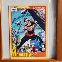 Front side of Wonder Man Marvel 1991 Super Heroes trading card depicting the superhero in action with orange bordered design.