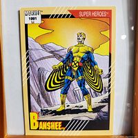 Front of the 1991 Marvel Super Heroes trading card showing Banshee in costume with mountain background.
