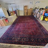Full view of carpet laid on warehouse floor with boxes and shelving in background
