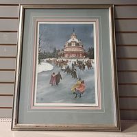 Full view of the framed limited edition Walter Campbell print showing the winter ice skating scene and the frame.