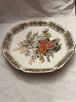 Wide top view of the octagonal porcelain platter showing full floral design and scalloped edge.