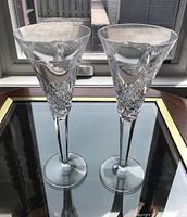 Two Waterford Crystal stemware glasses side by side showing overall shape and design.