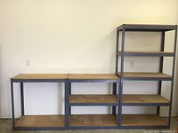 Full view of all shelving units together showing tall shelf and four shorter units with wood shelves.