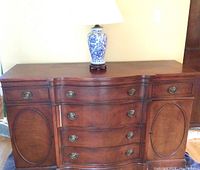 Full view of the Drexel dresser with ceramic lamp placed on top
