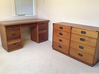 Both desk and drawer cabinet side by side in room