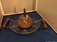 Image showing the Hughes Cornflower glass serving tray with metal frame and teak wood handles and dome knob.