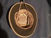 Top view showing the inner label and chin strap of the Tilley hat.