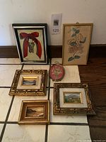 Set of 6 small framed artworks on floor showing all items in group, including oil paintings, acrylic keys painting, 3D dried flowers, and botanical print.