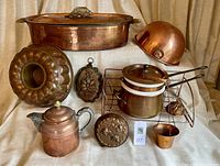 Overview of all copper kitchen items arranged on table