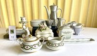 Full set of coffee and porcelain pieces including Rosenthal coffee service cups, pot, creamer, sugar bowl plus additional Limoges and Kaiser items arranged on a white surface