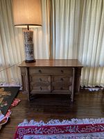 Full front view of buffet table with drawers and doors closed