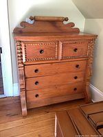 Front view showing two small upper drawers with barley twist trim and two larger lower drawers