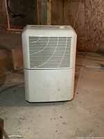 Front view of Maytag dehumidifier showing vent grille and general condition.