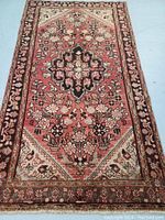 Overall front view of the hand knotted Hamedan rug laid flat