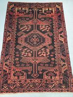 Full view of rug showing overall geometric pattern and color palette