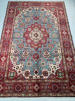 Full view of rug showing overall design, color and condition