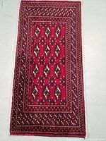 Top-down view of hand knotted wool rug showing full pattern and colors.