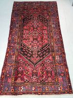 Full view of rug showing overall geometric medallion pattern and color palette.