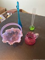 Overview of all four pieces together on a table under indoor lighting