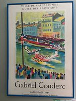 Front view of the colorful Gabriel Couderc 1984 exhibition poster in metal frame with glass, showing a riverside scene with boats and spectators and exhibition details text.