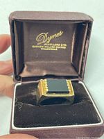 Ring in its original Degress Jewellers brown velvet presentation box