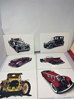 Six prints of classic cars displayed on a white backdrop, showing various designs and colors including black, red, yellow, and maroon cars.