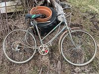 Full side view of Suntour Supercycle bicycle showing flat tires and rust damage on seat and frame.