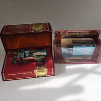 Two Matchbox Models of Yesteryear collector vehicle models in original display boxes, one green Leyland 3 Ton Whisky Lorry and one blue Model AC Mack