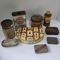 Photo showing nine vintage tins including product and advertising cans and boxes in various shapes