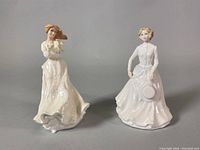 Front view of both Royal Doulton porcelain figurines, showing figurine poses, dresses, and details.