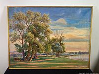 Full front view of framed oil painting showing trees, cattle and river