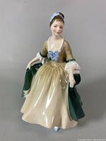 Front view of the Royal Doulton Elegance figurine showing detailed dress and facial features.