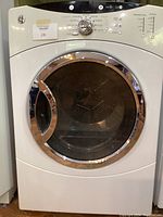 Front view of GE gas dryer showing door and control panel