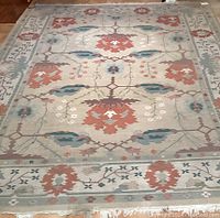Full front view of the rectangular area rug showing the entire surface, colors, and pattern design.